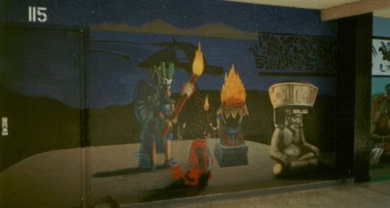 Around corner of hall (facing tennis court/smoking tree)