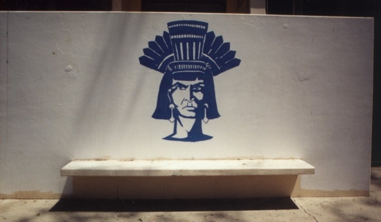 By the girls locker room.